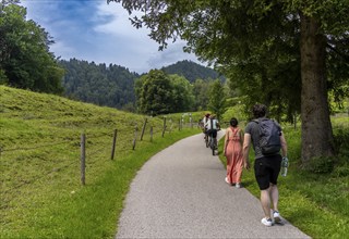 Cyclists and hikers on a circular route on Lake Tegernsee, Bavaria, Germany, Europe