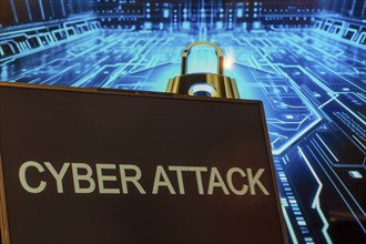 Cyber attack symbol: Laptop in front of a virtual computer background