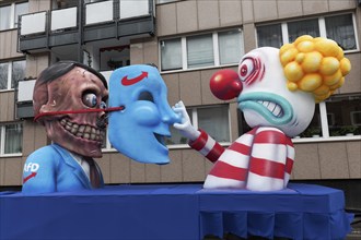 Behind the mask of the AFD is the skull of Hitler, papier-mâché figures, satirical float by Jacques