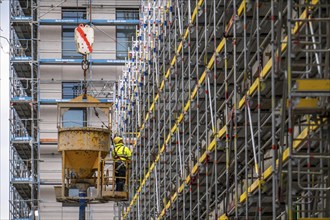 Concreting work on a construction site, new construction of a high-rise office building, facade of