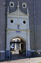 Tor Tor passage through the former Drommedaris defence defence tower at the entrance to the harbour