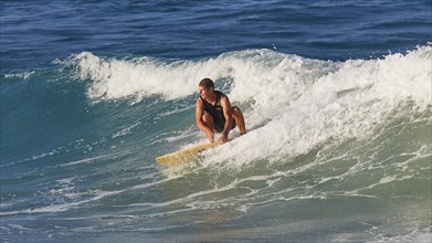 Surfer riding a wave in the blue ocean, wave surfer, surfer, surf, waves, west coast, Arkasa,