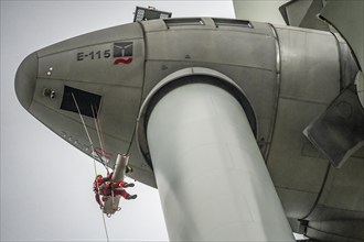 Height rescuers from the Oberhausen professional fire brigade practise abseiling from a wind