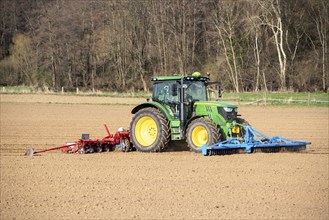 Sugar beet being sown in spring, precision sowing with precision seed drill, behind a tractor,