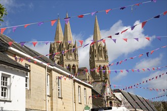 Spires of cathedral rise above historic town centre buildings, Truro, Cornwall, England, UK