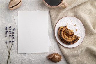 White paper invitation card, mockup with lavender, bun, cup of coffee, linen textile, seashell on