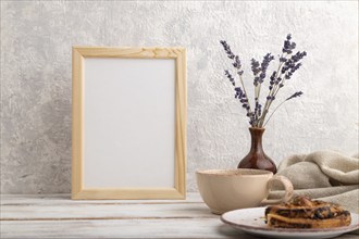 White wooden frame mockup with lavender in ceramic vase, linen textile, cup of coffee and bun on