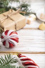 Christmas or New Year composition. Decorations, box, balls, cinnamon, fir and spruce branches, cup