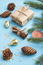 Christmas or New Year composition. Decorations, box, cinnamon, cones, fir and spruce branches, on a