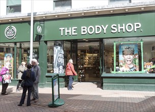 The Body Shop shoppers walking in street, Tavern Street, Ipswich, Suffolk, England, UK