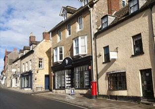 Shops and homes in historic buildings, Malmesbury, Wiltshire England, UK