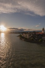 Cityscape, waterfront promenade, church tower, evening light, water reflection, Friedrichshafen on