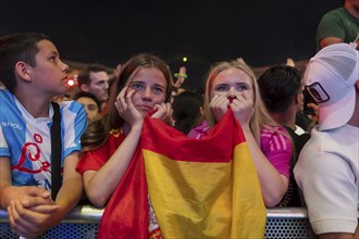 Two female fans of the Spanish team fear after the English equaliser at the Adidas fan zone at the