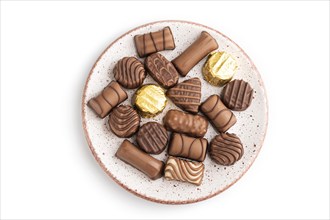 Chocolate candies isolated on white background. top view, flat lay, close up