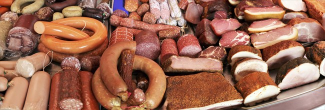 Panoramic picture of a sausage counter in a butcher's shop