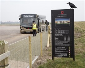 English Heritage admission prices sign and visitor bus transport to and from the Stones,