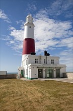 Red and white lighthouse on the coast at Portland Bill, Isle of Portland, Dorset, England, UK