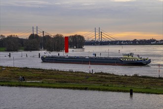 High water on the Rhine near Duisburg, freighter enters the harbour canal, Neuenkamp Rhine bridge,