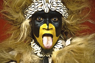 Portrait of a Zimba performer Gambia . Zimba dancers dress like a lion. While performing, they