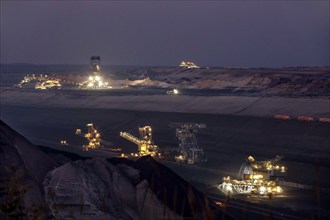 Lignite excavators extract coal in the Welzow open-cast mine, operated by LEAG. The lignite is