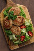 Fried cutlets, turkey, with vegetable salad, top view, no people