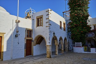 Agios Ioannis Prodromos Church, A whitewashed, historic church building with bell on a Greek