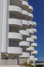 Modern holiday flats with round balconies at the harbour of Santa Eularia, Ibiza, Balearic Islands,