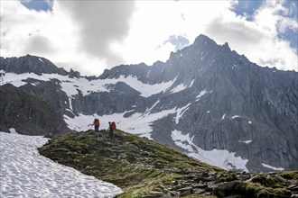 Mountaineer on a hiking trail, ascent to Schönbichler Horn, rocky summit Furtschaglspitze in the