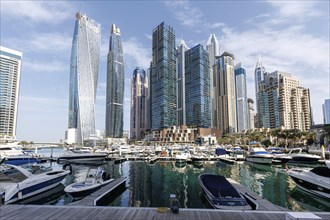 Dubai Marina skyline skyscrapers with yachts property skyscrapers living on the waterfront in