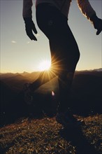 Trail running in autumn on the Jochberg on Lake Walchensee against the wonderful backdrop of the