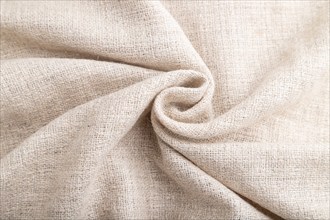 Fragment of white linen tissue. Side view, natural textile background and texture. wave concept,