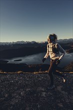 Trail running in autumn on the Jochberg on Lake Walchensee against the wonderful backdrop of the