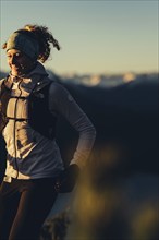 Trail running in autumn on the Jochberg on Lake Walchensee against the wonderful backdrop of the