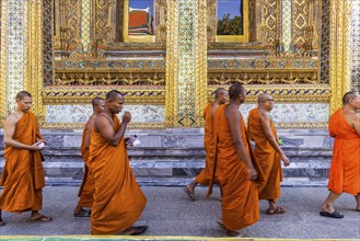 Wat Phra Kaeo temple, royal palace. Royal chapel with Buddhist monks and novices. Bangkok,