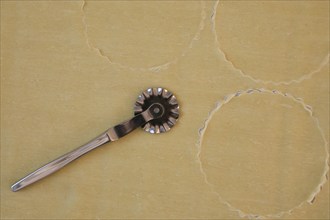 Swabian cuisine, preparation of salmon ravioli, cutting raw pasta dough with a pastry wheel, salmon