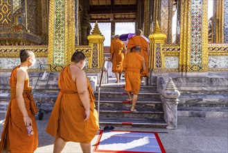 Wat Phra Kaeo temple, royal palace. Royal chapel with Buddhist monks and novices. Bangkok,