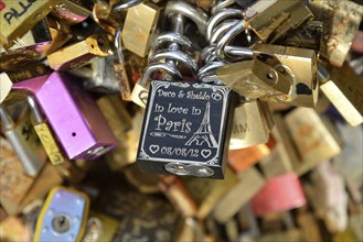 Love padlocks attached to the railing of the Pont de l'Archevêché bridge, Paris, France, Europe