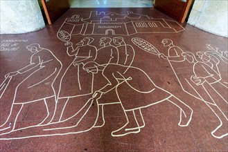 Drawings and painting on the floor at the entrance to the Sagrada Familia, Barcelona, Catalonia,