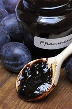 Plum jam in jar and plums, plum, plum plum, plum plum, plum, spoon, wooden spoon