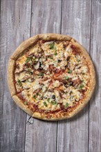 Pizza on an old wooden table