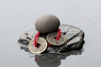 Stones and Chinese lucky coins, coins, lucky coins, lucky coin, coin, in water