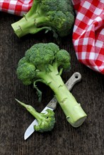 Broccoli (Brassica oleracea var. italica) and knife