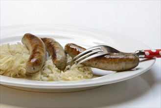 Nuremberg sausages with sauerkraut on a plate, Rostbratwurst, Germany, Europe