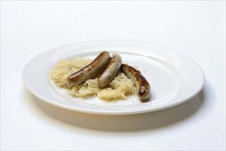 Nuremberg sausages with sauerkraut on a plate, Rostbratwurst, Germany, Europe