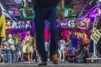 Crowds of people on Bangla Street in the evening. Nightlife on Bangla Walking Street with go-go