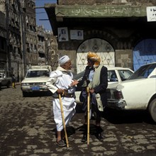 Two men talking in the old town of Sanaa, UNESCO World Heritage Site, Sanaa, Yemen, Asia