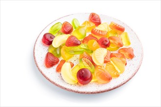 Various fruit jelly candies on plate isolated on white background. top view, flat lay, close up