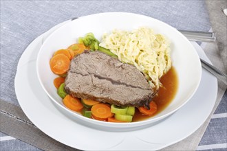 Swabian cuisine, roast beef, roast ox, herb spaetzle, meat dish, gravy, carrot vegetables, leek,