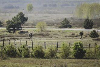 Two armed soldiers, photographed as part of a Bundeswehr exercise with forces from Norway and the