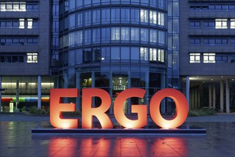 Illuminated logo in front of the headquarters of the ERGO Insurance Group, blue hour, Düsseldorf,